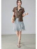 Light blue polka dot skirt with tiered ruffles and high waist.