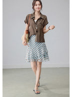 Light blue polka dot skirt with tiered ruffles and high waist.