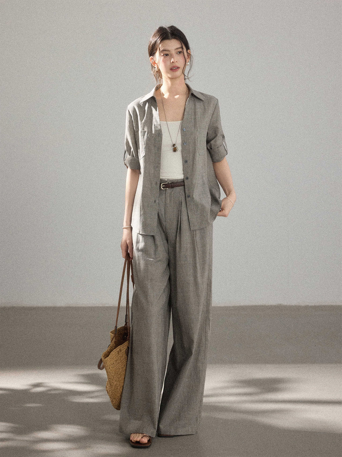 Grey wide-leg pants with high-rise and pleated front