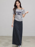 Navy blue and white striped midi skirt with side slit and drawstring waist.