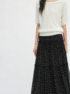 Black floral A-line skirt with tiered sheer hem and gathered waist