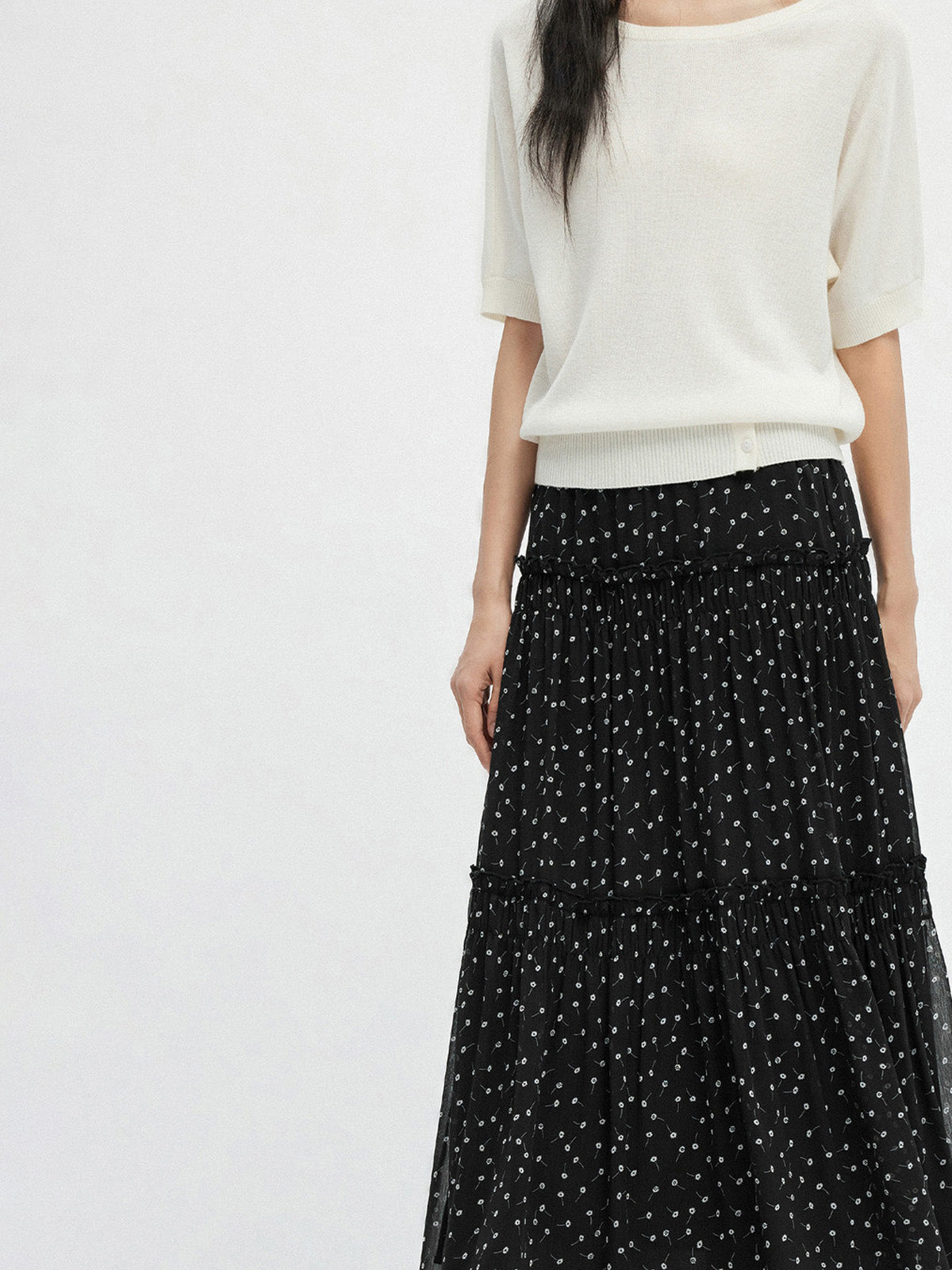 Black floral A-line skirt with tiered sheer hem and gathered waist
