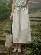 Beige A-line skirt with drawstring waist and side pockets