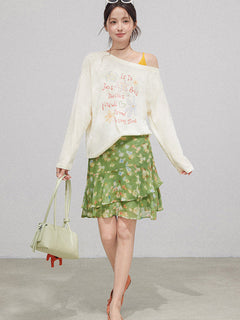 Green floral high waist skirt with layered ruffles and ruffled hem.