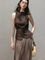 Brown sleeveless tank top with high neck and draped asymmetric hem