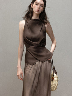 Brown sleeveless tank top with high neck and draped asymmetric hem