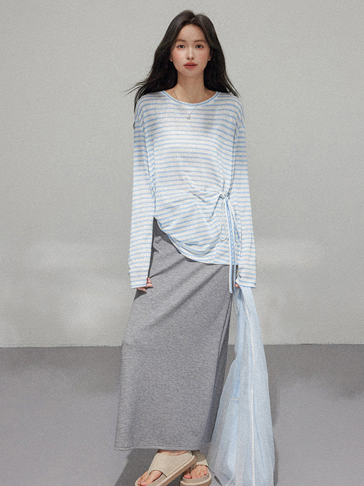 Grey A-Line Midi Skirt with side slit and drawstring waist, shown in full length.