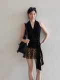 Black halter top with V-neck and asymmetric hem, front view