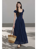 Navy blue dress with square neckline, puffed sleeves, and A-line silhouette