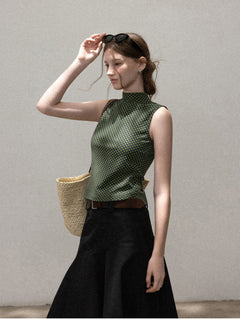 Fitted green polka dot tank top with high neckline
