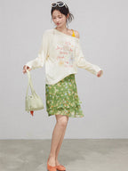 Layered green floral skirt with ruffled layers and high waist.