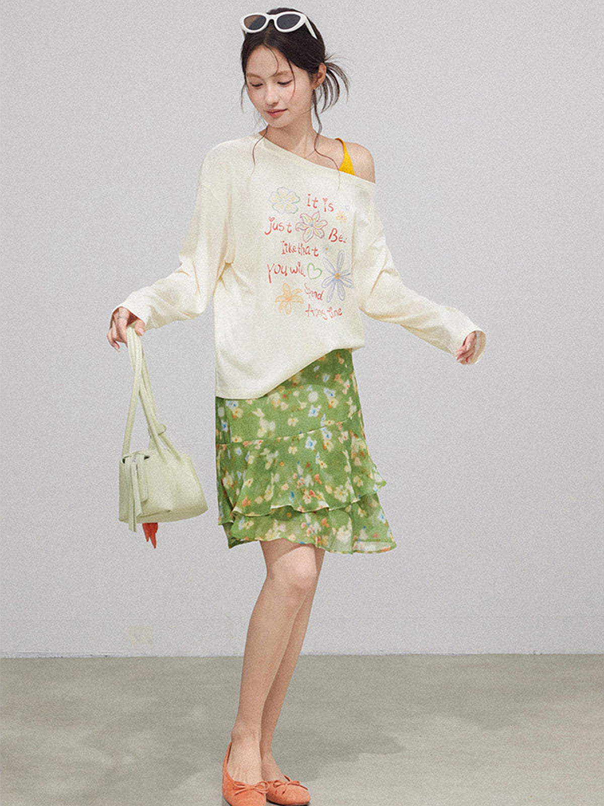 Layered green floral skirt with ruffled layers and high waist.