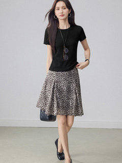 Grey and black leopard print flared a-line skirt with pleated fabric.