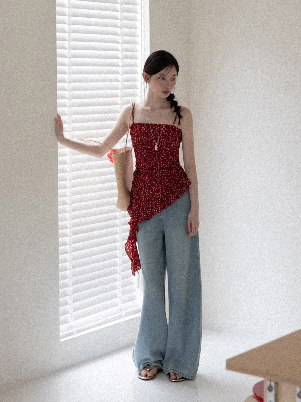 Red floral tank top featuring a square neckline and peplum waist.