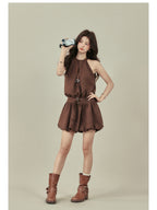 Brown sleeveless dress featuring a pleated skirt section and attached belt.