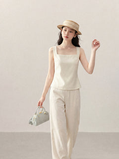 Front view of ivory sleeveless tank top with square neckline.