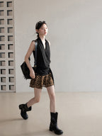 Black halter top with wrap detail and tied side, back view