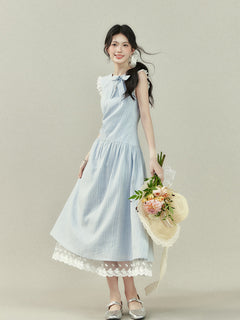 Light blue sleeveless dress with vertical stripes, lace trim on the shoulders and hem, a bow tie neckline, and an A-line silhouette.
