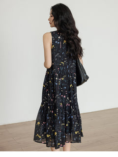 Black tiered midi dress featuring a V-neckline and gathered waist