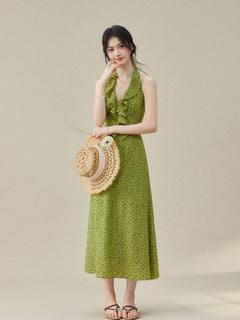 Halter neck dress with small floral print and flared hem.