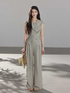 Full-length wide-leg pants in light grey with vertical stripes.