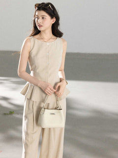 Beige wide-leg pants with pleats at the front of the waist