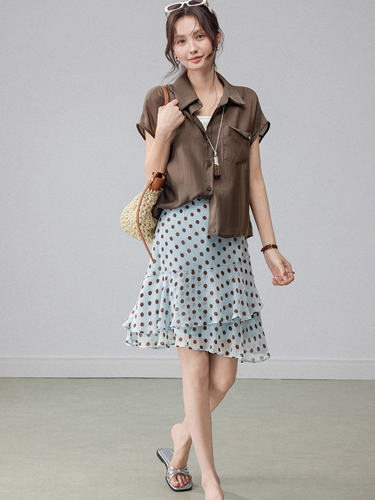 Light blue polka dot A-line skirt with tiered ruffles and high waist.