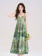 Green floral dress with thin straps and a v-neckline.