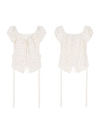A cream polka dot fitted top with puff short sleeves, shown from the front and back.