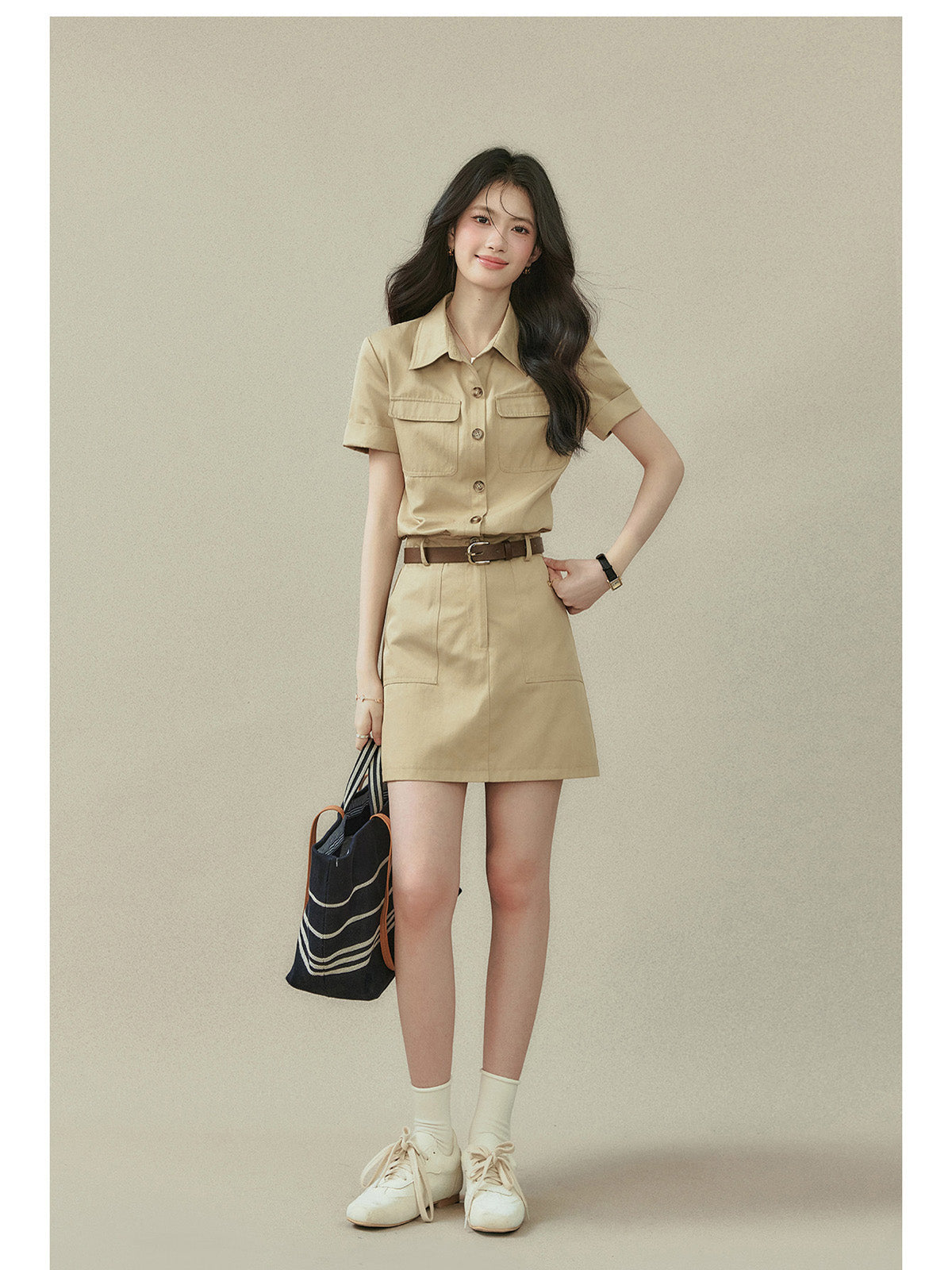 Beige collared shirt dress featuring two chest pockets and a straight hem.