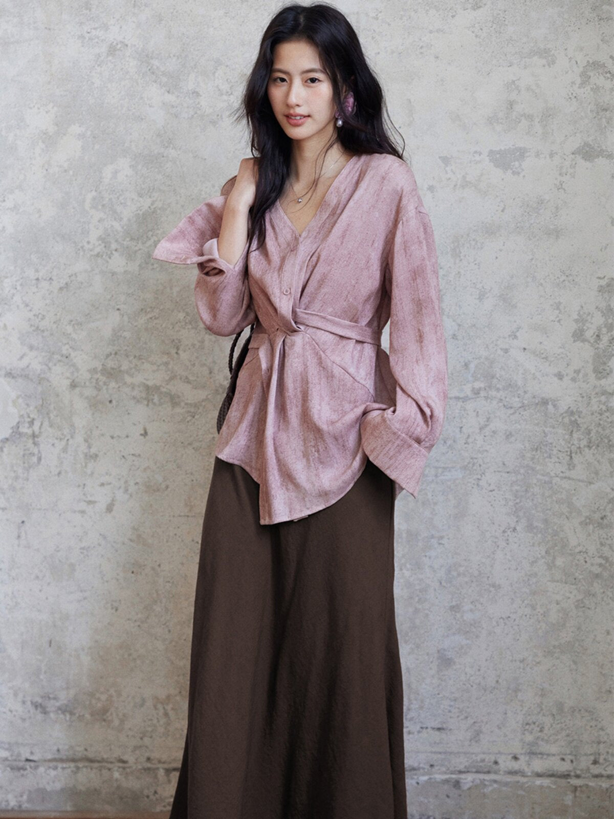Long coffee brown skirt with high waist and flared hem.