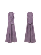 A front and back view of a purple sleeveless maxi dress with a wrap front and side slit.