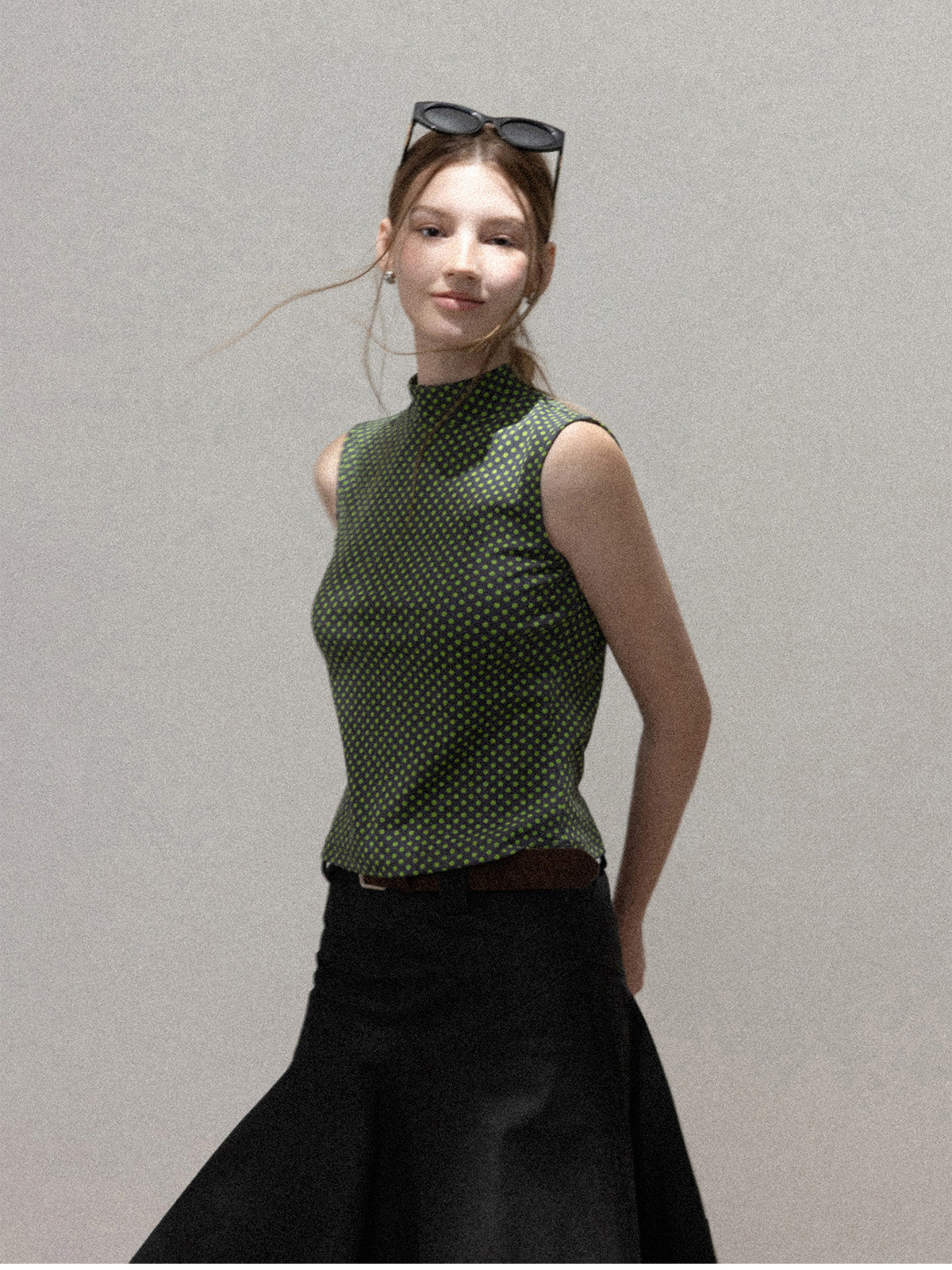 High neck green polka dot tank top worn alone