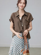 Polka dot light blue skirt with layered ruffles and a high waist.