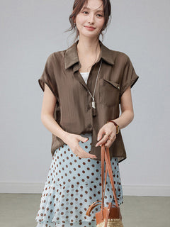 Polka dot light blue skirt with layered ruffles and a high waist.