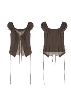 Flat lay of brown puff sleeve top with lace trim and side ties.