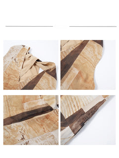 Close-up details of the neckline and fabric texture of a long dress with a brown and beige patchwork pattern.