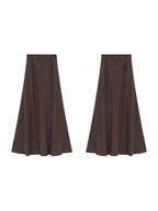 Brown textured fabric long skirt with high waist and flared hem.