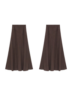 Brown textured fabric long skirt with high waist and flared hem.