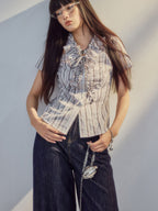 Blouse in grey purple stripes, front tie detail, asymmetrical hem.