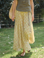 Yellow plaid long skirt with asymmetrical hem and gathered fabric