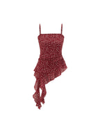 Red floral tank top with ruched waist and thin straps visible.