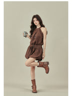 Brown dress with flared hem and waist belt, worn with brown boots.