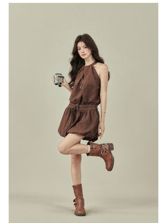 Brown dress with flared hem and waist belt, worn with brown boots.