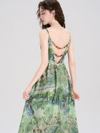 Green floral dress with a v-neckline and thin straps.