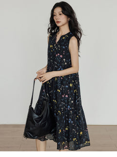 Black midi dress with tiered skirt, V-neck, and side pockets
