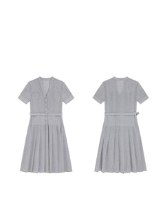 A flat lay of a grey A-line midi dress with short sleeves, a V-neck collar, and pleated skirt.