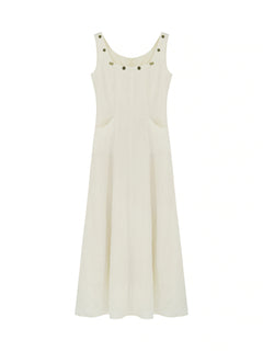Ivory dress with a square neckline, thin straps, embroidered trim, and side pockets.