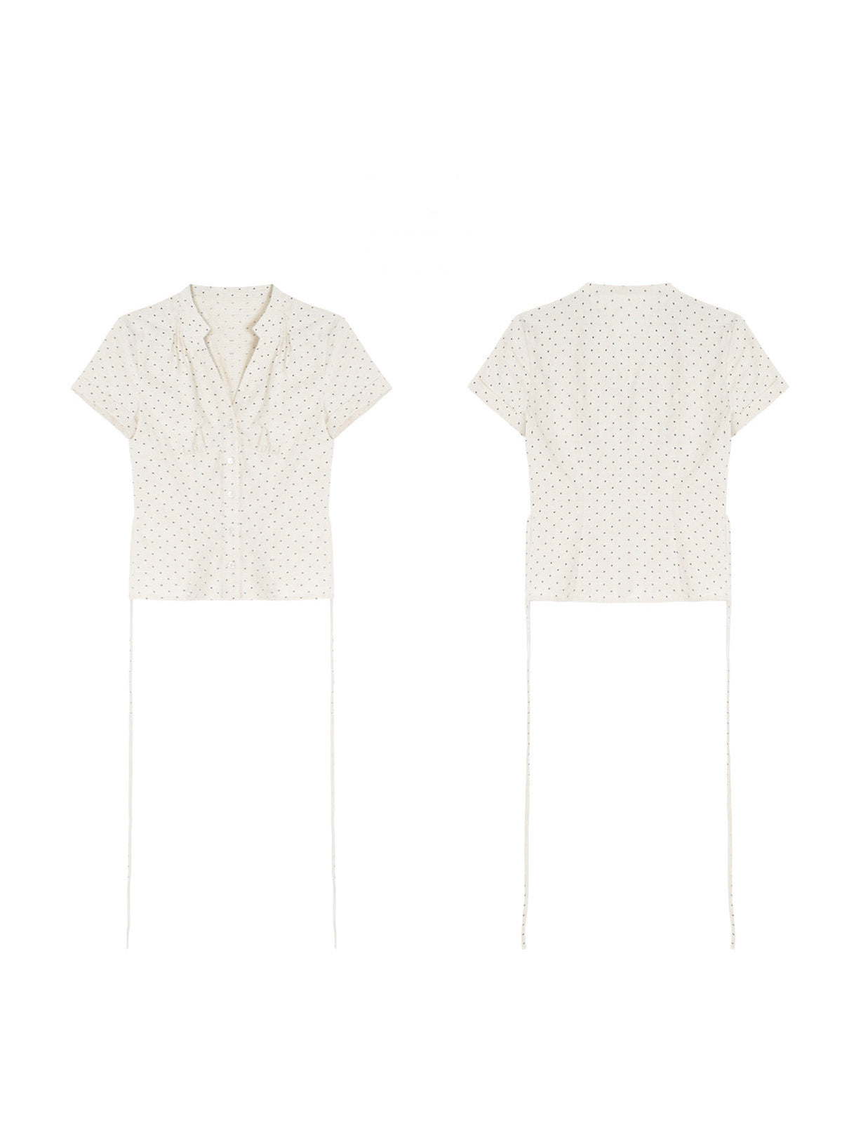 A cream polka dot short-sleeve top with a V-neck and button-front closure shown in flat lay.