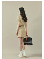 Beige short-sleeve dress with a straight hem and button placket.
